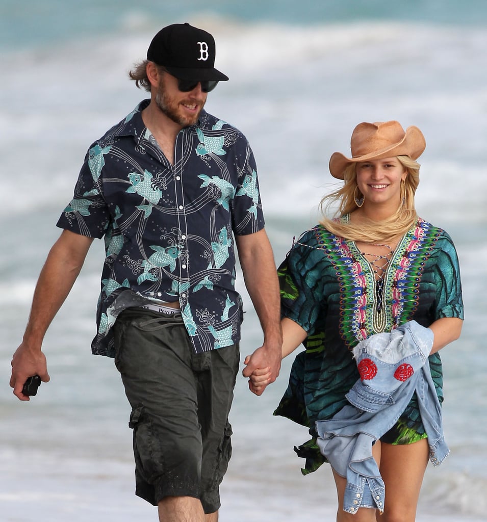 Eric and Jessica held hands while taking a walk on the beach in Hawaii back in December 2012.