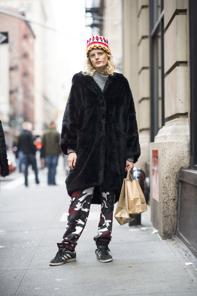Hanne Gaby Odiele stayed spunky with camo-print pants, an oversize furry jacket, and a bright beanie.
Source: Le 21ème | Adam Katz Sinding