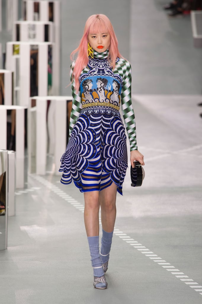 We'd love to see her in a piece with bold long sleeves and a turtleneck. Michelle would likely nix the socks-and-sandals look for a pair of sleek kitten heels, but her dress would do all the talking.
Mary Katrantzou Spring 2017.