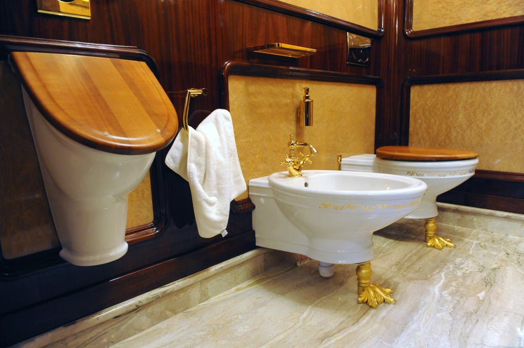 One of the estate's bathrooms features gold-accented toilets.