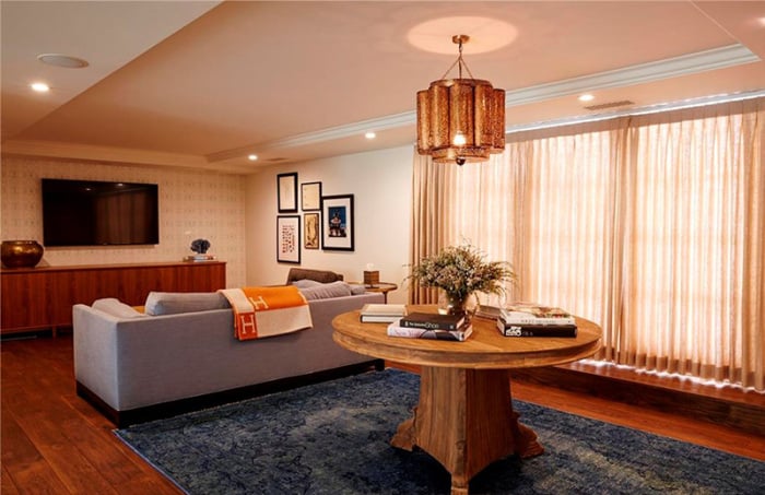 The second living area features an equally as stylish light fixture and decor.