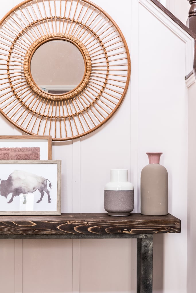 Thoughtful decor pieces like vases ($158 for set of five) and framed art in a neutral color palette transform the once-bare space into a gracious entryway. To help hold odds and ends, Monica scattered numerous baskets ($152 for set of three) and bowls ($29) throughout the space.