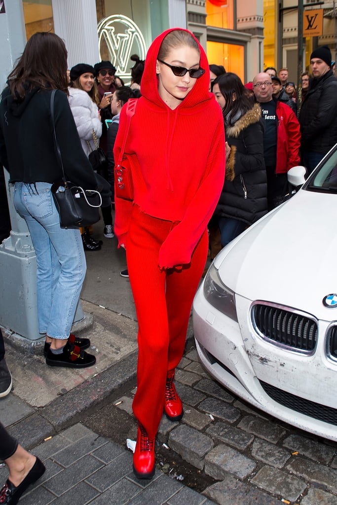 Gigi hit the streets of New York City in an all red outfit and Gigi Hadid for Vogue Eyewear sunglasses.