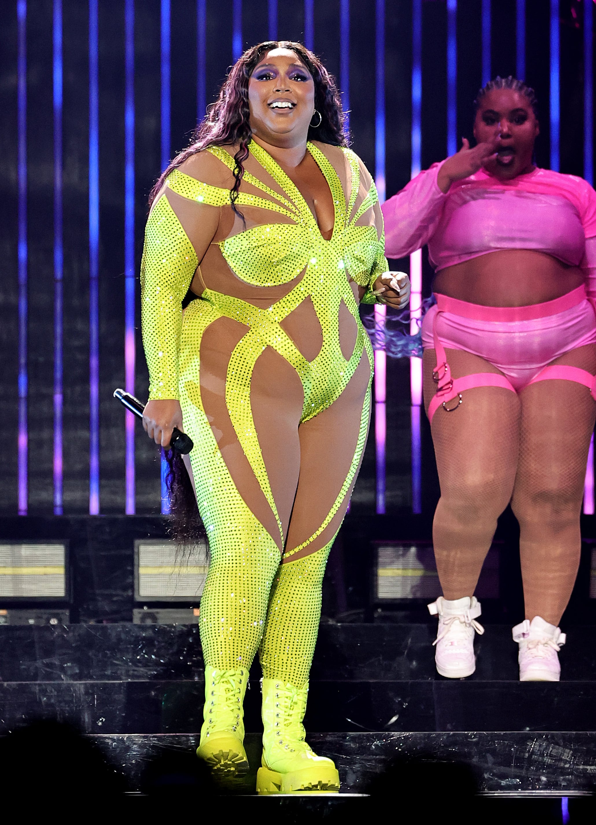 Lizzo Sparkled in Pink Jumpsuit and Feathers for NYC Show