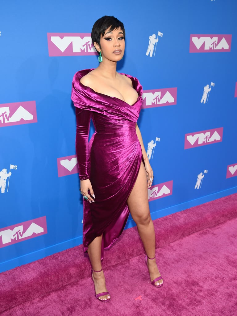 Cardi made her first post-baby appearance at the MTV VMAs this August wearing a velvet Nicolas Jebran dress, emerald Lorraine Schwartz earrings, and strappy heels.