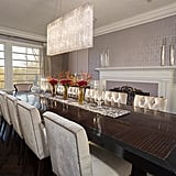 Statement lighting fixtures, like this rectangular glass chandelier in the dining room, give a nod to the midcentury decor of Dorothy Draper while aligning with Jennifer's personal style.