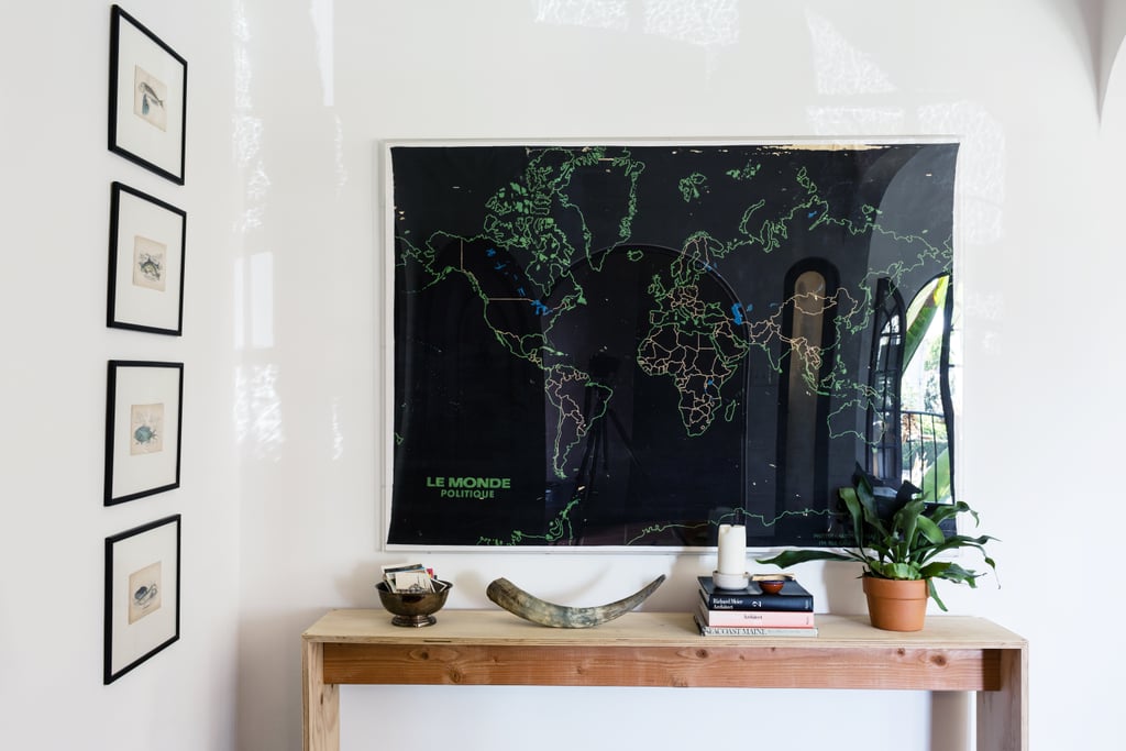 In the entry, Lizzie displays a Belgian map she picked up at the Rose Bowl Flea Market. Beneath it, a simple plywood table made by her husband.