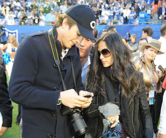 Demi Moore and Ashton Kutcher got ready for the game on the sidelines in 2010.