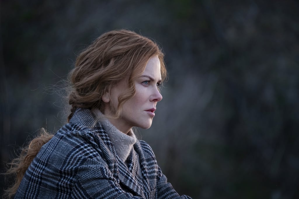 Grace wears the checked coat with a cozy, neutral turtleneck by Max Mara to stay warm by the chilly waters.