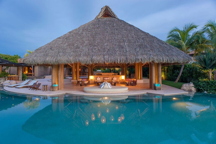 The villa includes two infinity pools that blend seamlessly into the Pacific Ocean.