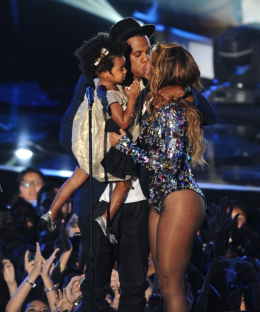 Jay Z and Beyoncé shared a romantic kiss while on stage with their daughter, Blue Ivy, at the MTV Video Music Awards in LA in August 2014.
