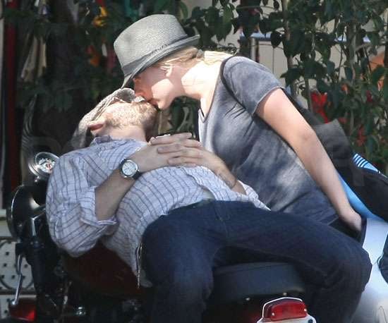 Scarlett and Ryan Reynolds shared a sexy smooch on a motorcycle in 2008.