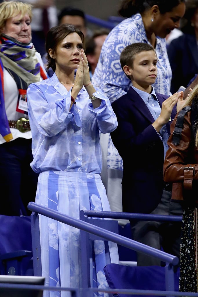 Victoria Beckham Wearing Blue Top and Skirt