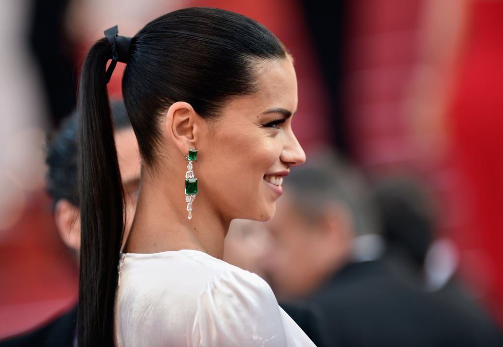 At the premiere of Julieta, Adriana Lima wore her glossy brunette strands slicked back into a taut ponytail.