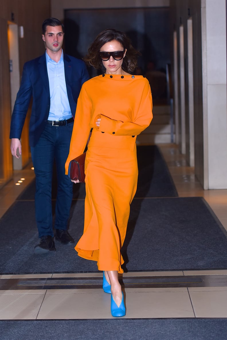 Pairing a Bright Orange Dress With Blue Pumps