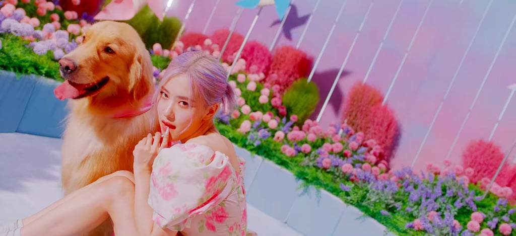 Rosé from Blackpink wears a floral pouf-sleeved dress.