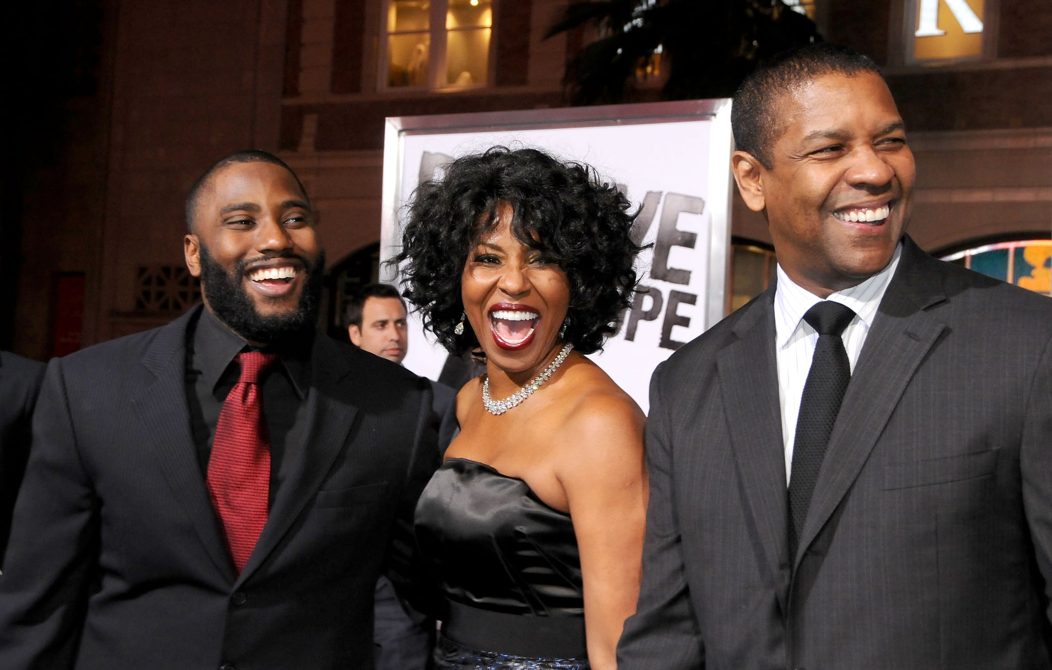 HOLLYWOOD, CA - JANUARY 11: John David Washington, Pauletta Washington and Denzel Washington arrive at 