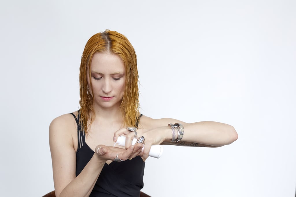 Distribute two to four pumps of a styling cream, such as Hairstory’s Dressed Up, into your hands. Emulsify the product between your palms, and work it evenly through your strands from roots to ends.