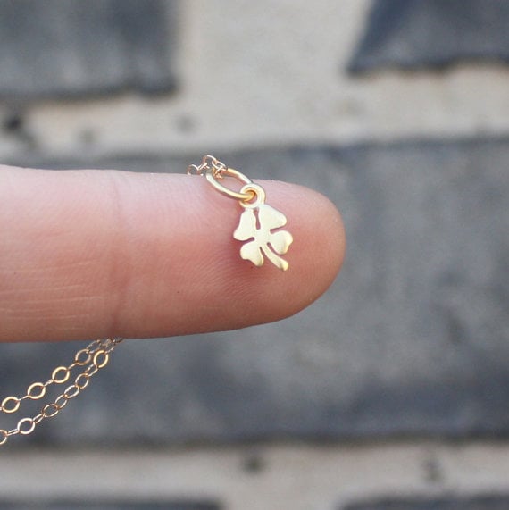 Gold four-leaf clover pendant