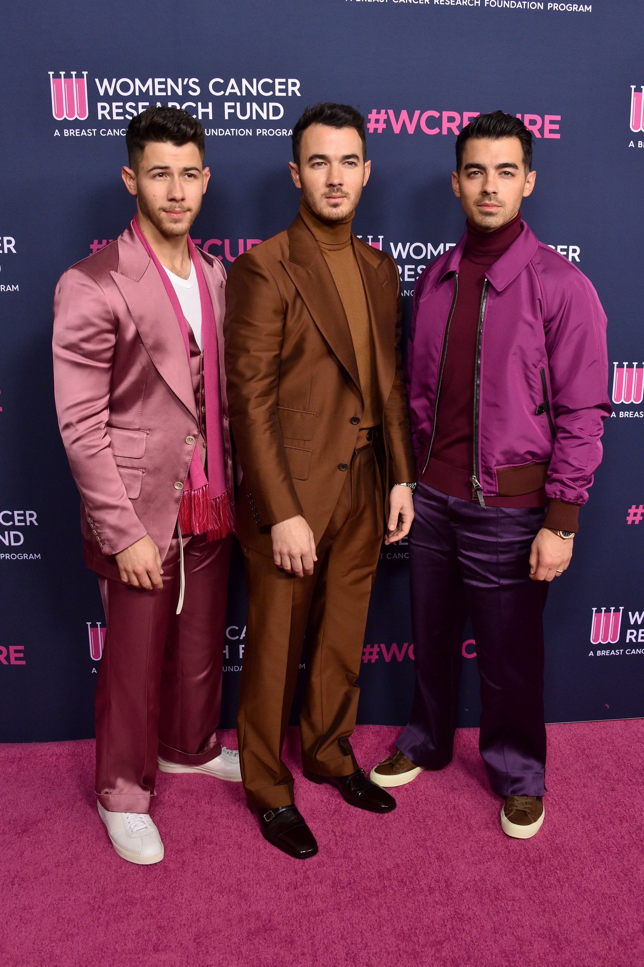 BEVERLY HILLS, CALIFORNIA - FEBRUARY 27: (L-R) Nick Jonas, Kevin Jonas, and Joe Jonas of The Jonas Brothers attend WCRF's 