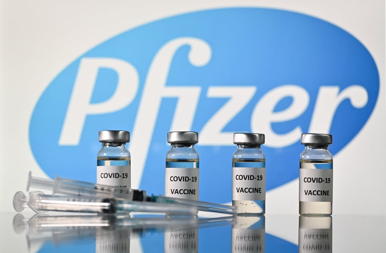 An illustration picture shows vials with Covid-19 Vaccine stickers attached and syringes with the logo of US pharmaceutical company Pfizer, on November 17, 2020. (Photo by JUSTIN TALLIS / AFP) (Photo by JUSTIN TALLIS/AFP via Getty Images)