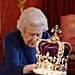 Queen Elizabeth II Plays With Her Crown