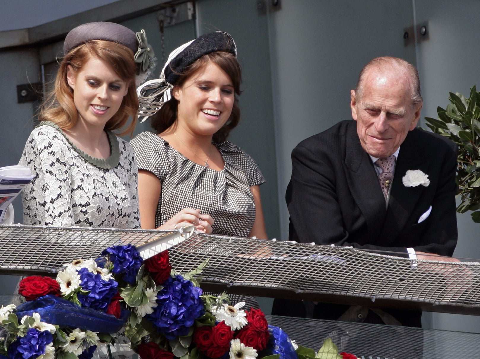 EPSOM, UNITED KINGDOM - JUNE 02: (EMBARGOED FOR PUBLICATION IN UK NEWSPAPERS UNTIL 48 HOURS AFTER CREATE DATE AND TIME) Princess Beatrice, Princess Eugenie and Prince Philip, Duke of Edinburgh watch the racing from the balcony of the Royal Box on Derby Day at the Investec Derby Festival horse racing meeting at Epsom Racecourse on June 2, 2012 in Epsom, England. For only the second time in its history, the UK celebrates the Diamond Jubilee of a monarch. Her Majesty Queen Elizabeth II celebrates the 60th anniversary of her ascension to the throne. Thousands of wellwishers from around the world have flocked to London to witness the spectacle of the weekend's celebrations. The Queen along with all the members of the royal family will participate in a River Pageant with a flotilla of 1,000 boats accompanying them down the Thames, a star studded free concert at Buckingham Palace, and a carriage procession and a Service of Thanksgiving at St Paul's Cathedral. (Photo by Indigo/Getty Images)