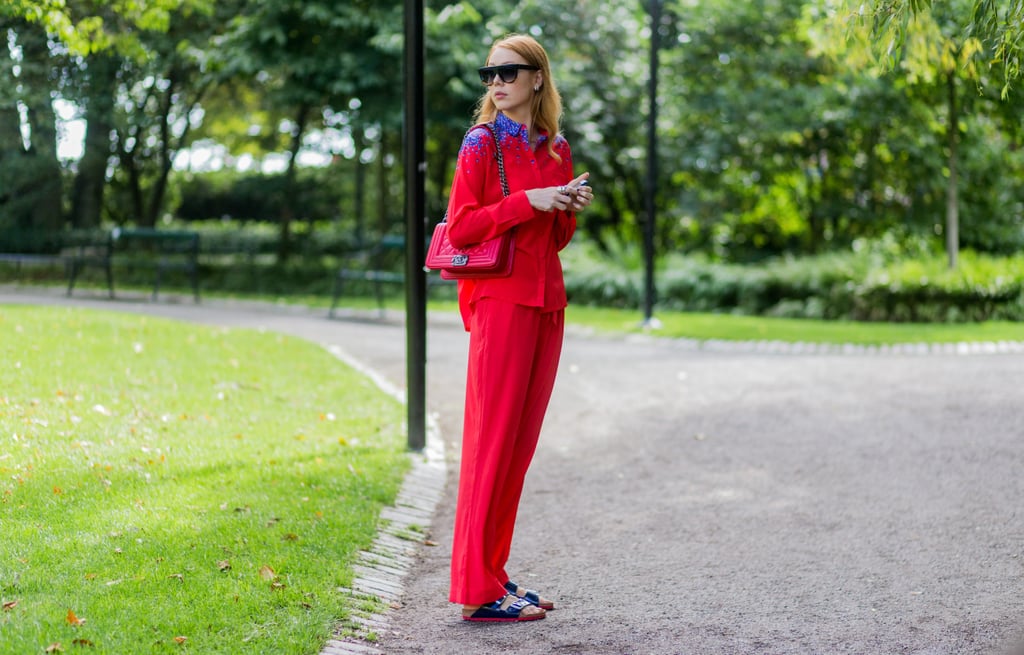 A Red Suit Is Intriguing, Yes, but Even More So With Birkenstocks in Place of Heels