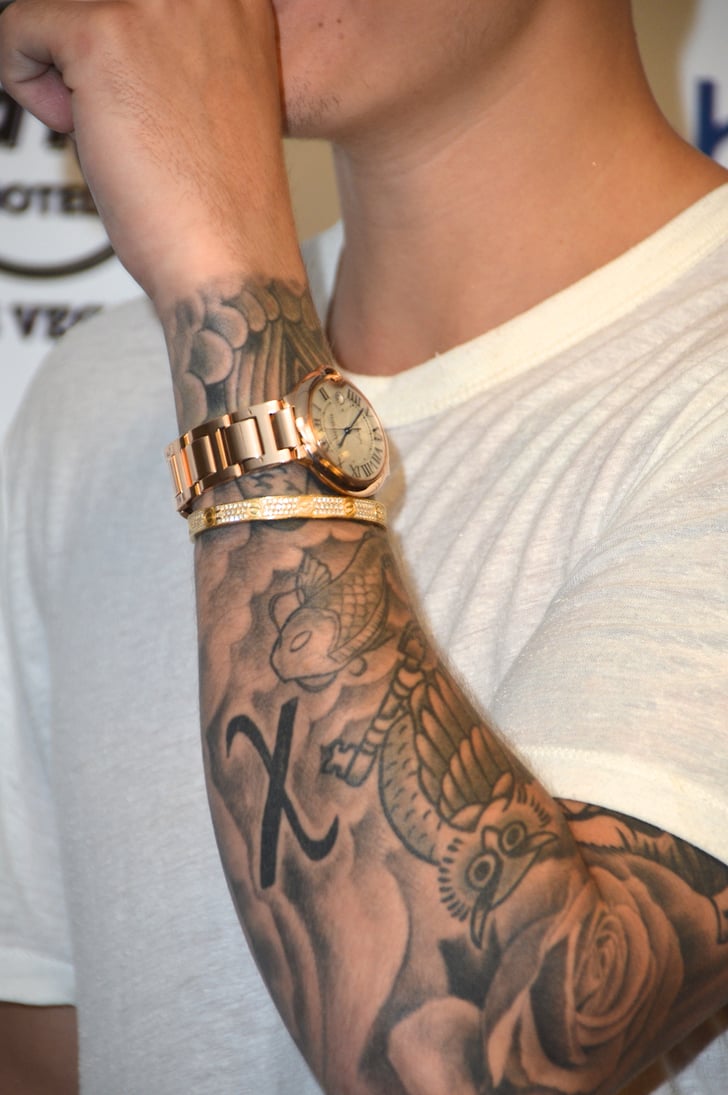Justin has a bolded "X" on his left arm. | What Do Justin ...