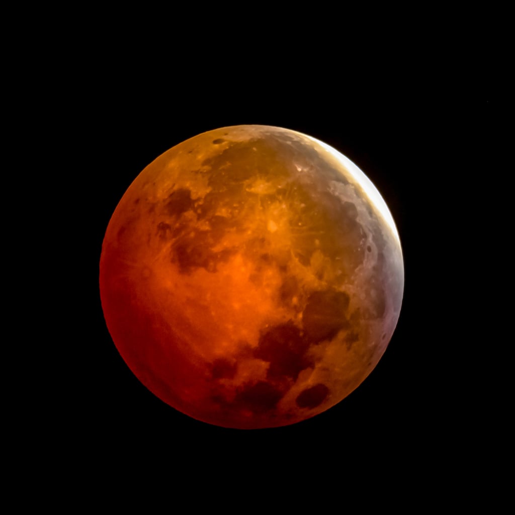 What Tomorrow's Lunar Eclipse Means For Your Sign, According to an Astrologer