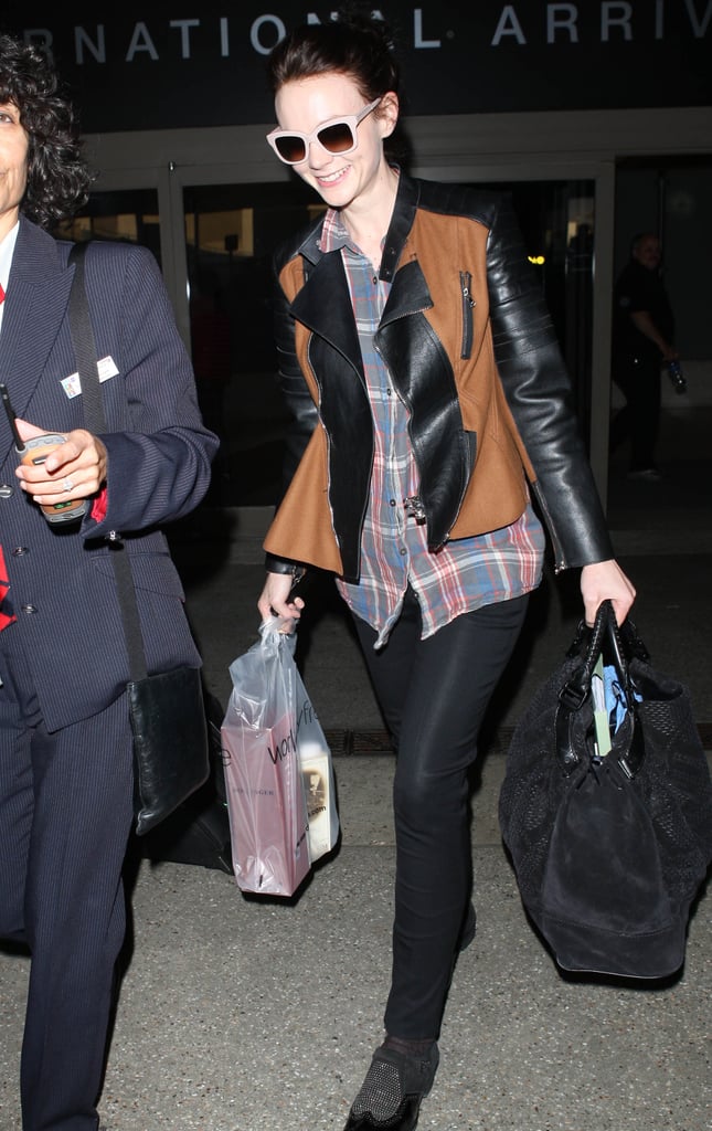 Let's make Carey Mulligan an official member of the cool kids club already. The actress paired a plaid top and black pants with a two-toned, leather-sleeved jacket for an extra dose of warmth. The final movie-star touch? Those nude-framed sunglasses.