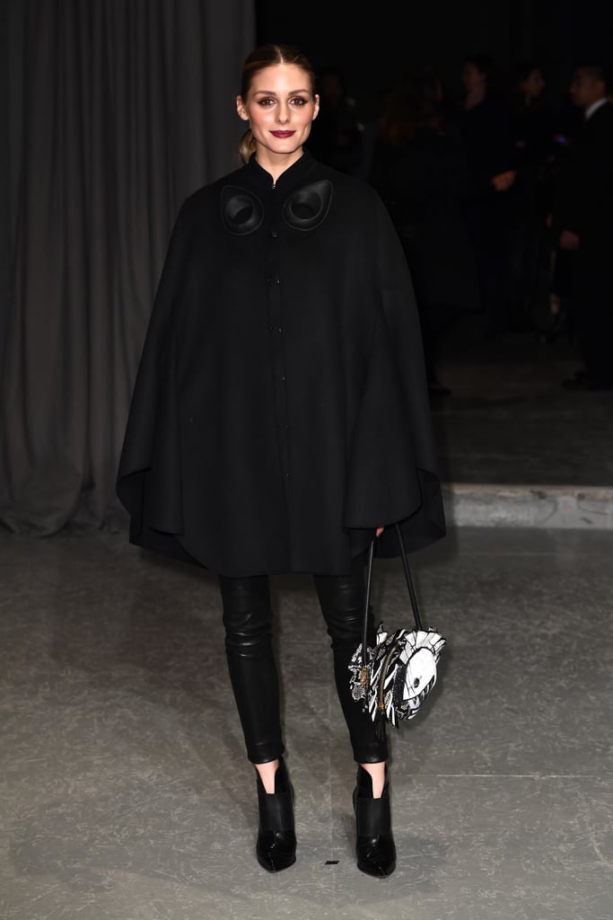 Who needs to think about a top when you have a cape? Olivia made a case for investing in dramatic outerwear when she stepped out in this look at the Burberry show in London.