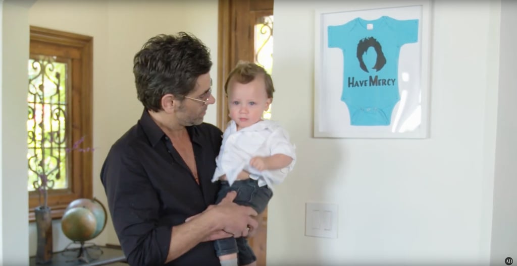 A blue onesie from his son's gender reveal is proudly displayed on the wall. A blue onesie from his son's gender reveal is proudly displayed on the wall.