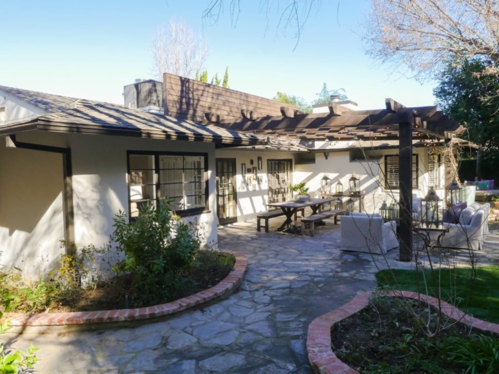 The back patio is filled with ranch-style charm. 
Source: Sotheby's Realty