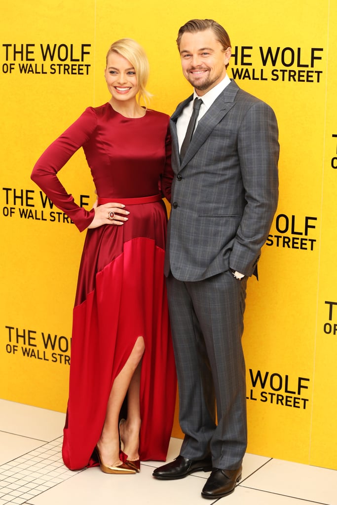 Leonardo DiCaprio smiled big when he attended the UK premiere of The Wolf of Wall Street in London with costar Margot Robbie.