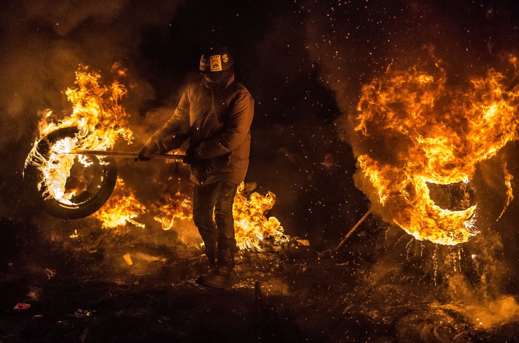 Burning tires lined the edge of the camp.