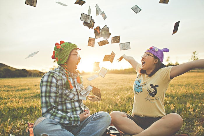 We love how Kitty and Ted's engagement photos by Orange Turtle Photography not only show off how cool of a couple they are, but also their favorite things, including the Incan Gold game and . . . 
Photo: Orange Turtle Photography