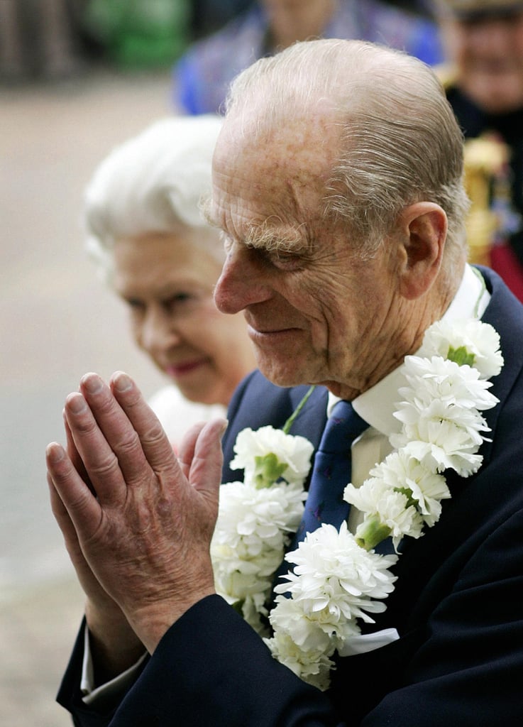 Prince Philip clasped his hands as the pair arrived for a visit to the Sikh Temple in Hounslow, West London.