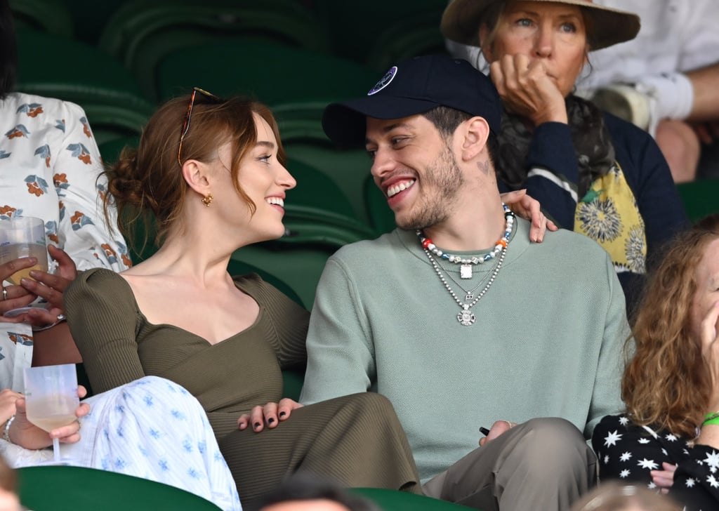 Game, set, they're a match! On Saturday, Pete Davidson and Phoebe Dynevor made their official public debut as a couple while attending day six of the Wimbledon Tennis Championship, and they kept cuddled up for the entire event. Look closely, and you can spot Pete wearing the "PD" necklace they both share. If that isn't cute, we don't know what is. 
Phoebe and Pete have been linked ever since they first sparked relationship rumors in March. According to Entertainment Tonight, the duo hit it off when they met in New York City. Now the Saturday Night Live star and Bridgerton leading lady are taking their love across the pond. Get a look at their sweet outing in the photos ahead. 

    Related:

            
            
                                    
                            

            What&apos;s It Like Dating Pete Davidson? Here&apos;s What His Exes Have Said