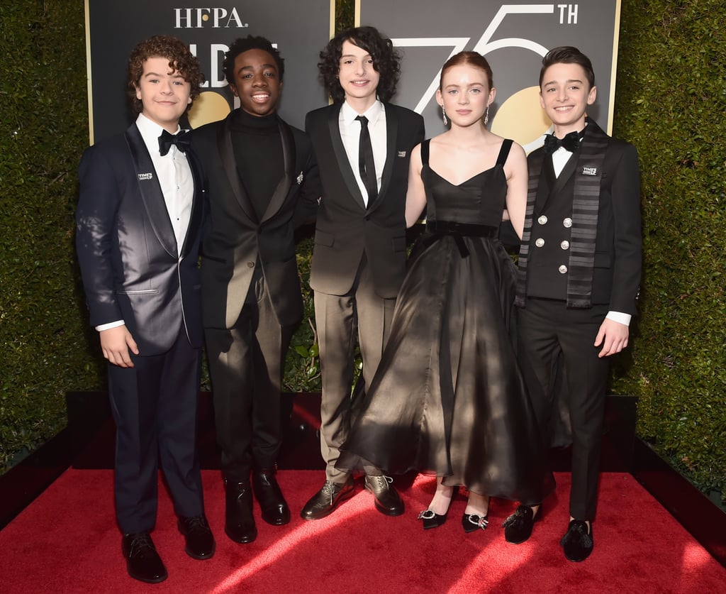The Golden Globes got a dose of the Upside Down's best on Sunday night when the cast of Stranger Things rolled through. David Harbour — aka Sheriff Jim Hopper, aka everyone's not-so-secret crush — cleaned up nice in an all-black suit, while the younger cast looked more grown up than ever. Millie Bobby Brown, Gaten Matarazzo, Caleb McLaughlin, Finn Wolfhard, Sadie Sink, and Noah Schnapp hit the red carpet in formal wear that would make the jaws of anyone at the Hawkins Middle School Snow Ball hit the floor. See the best photos from their night out below!

    Related:

            
            
                                    
                            

            23 Snaps of the "Stranger Things" Cast That Prove They&apos;re One Big Happy Family