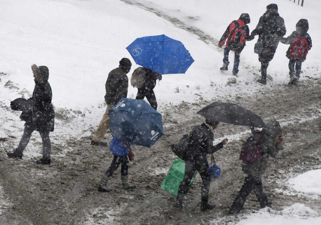 Commuters struggled as they made their way through the NYC snow.