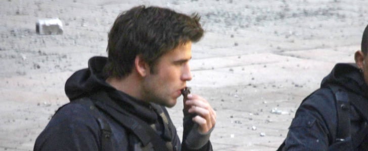 Liam Hemsworth Eating Chocolate on the Mockingjay Set