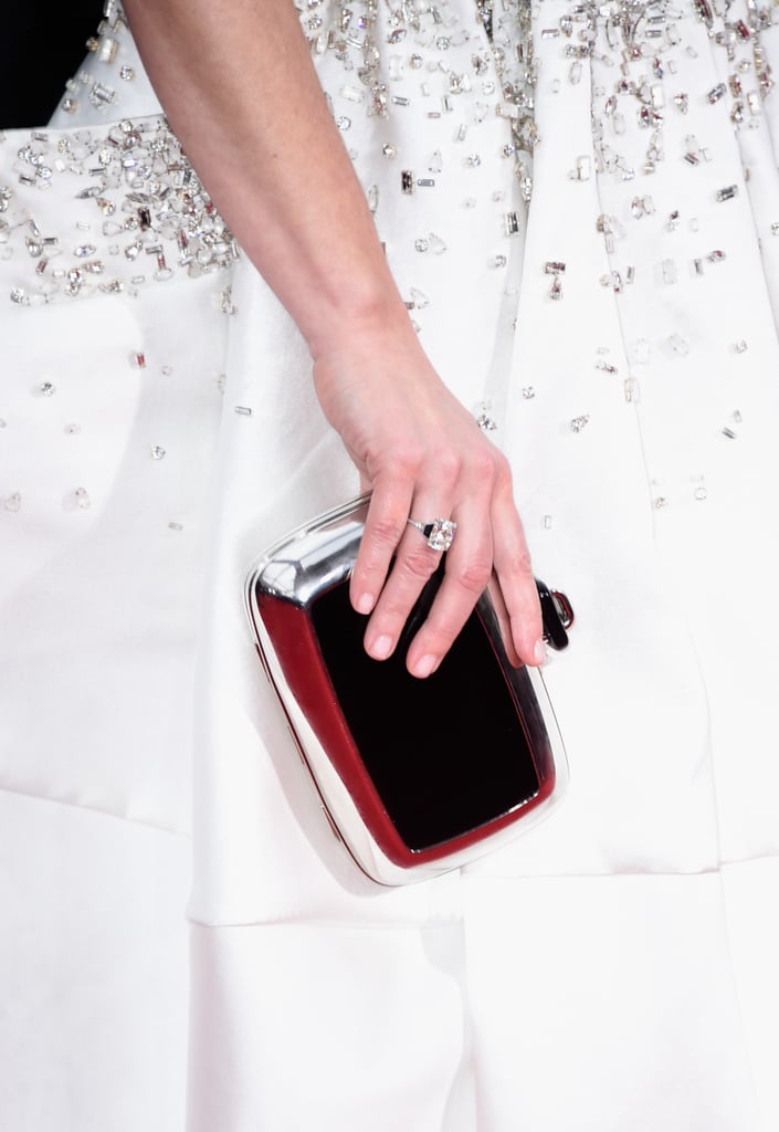 Tina Fey paired her clutch with an antique 9-carat cushion-cut diamond and onyx ring from Fred Leighton.