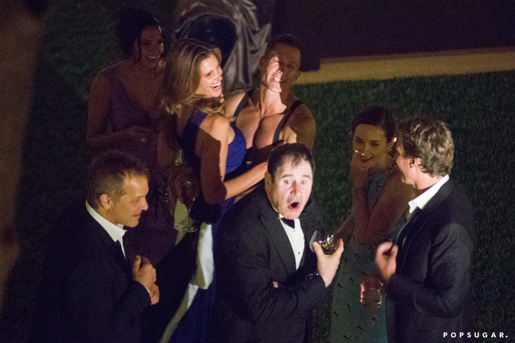A group of guests, including Cindy Crawford and Richard Kind, celebrated outside.
