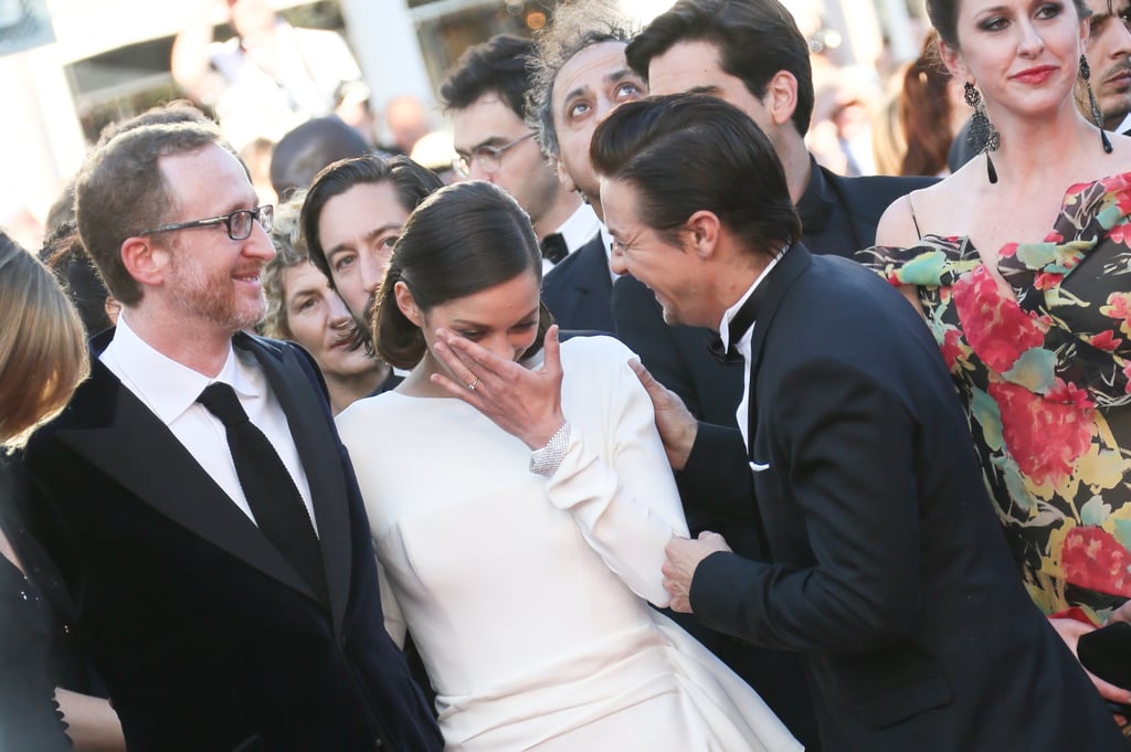 Marion Cotillard got emotional during the 2013 red carpet premiere of The Immigrant; her costar, Jeremy Renner, helped her compose herself.