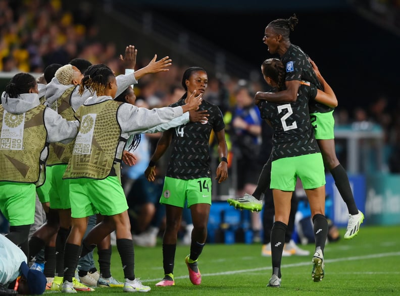 BRISBANE, AUSTRALIA - JULY 27: Uchenna Kanu (1st R) of Nigeria celebrates with teammates after scoring her team's first goal during the FIFA Women's World Cup Australia & New Zealand 2023 Group B match between Australia and Nigeria at Brisbane Stadium on 