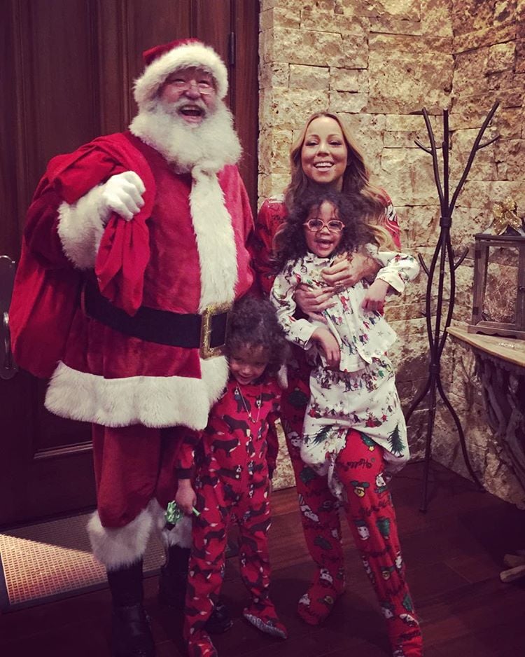 Mariah Carey and her twins caught Santa Claus dropping off presents.