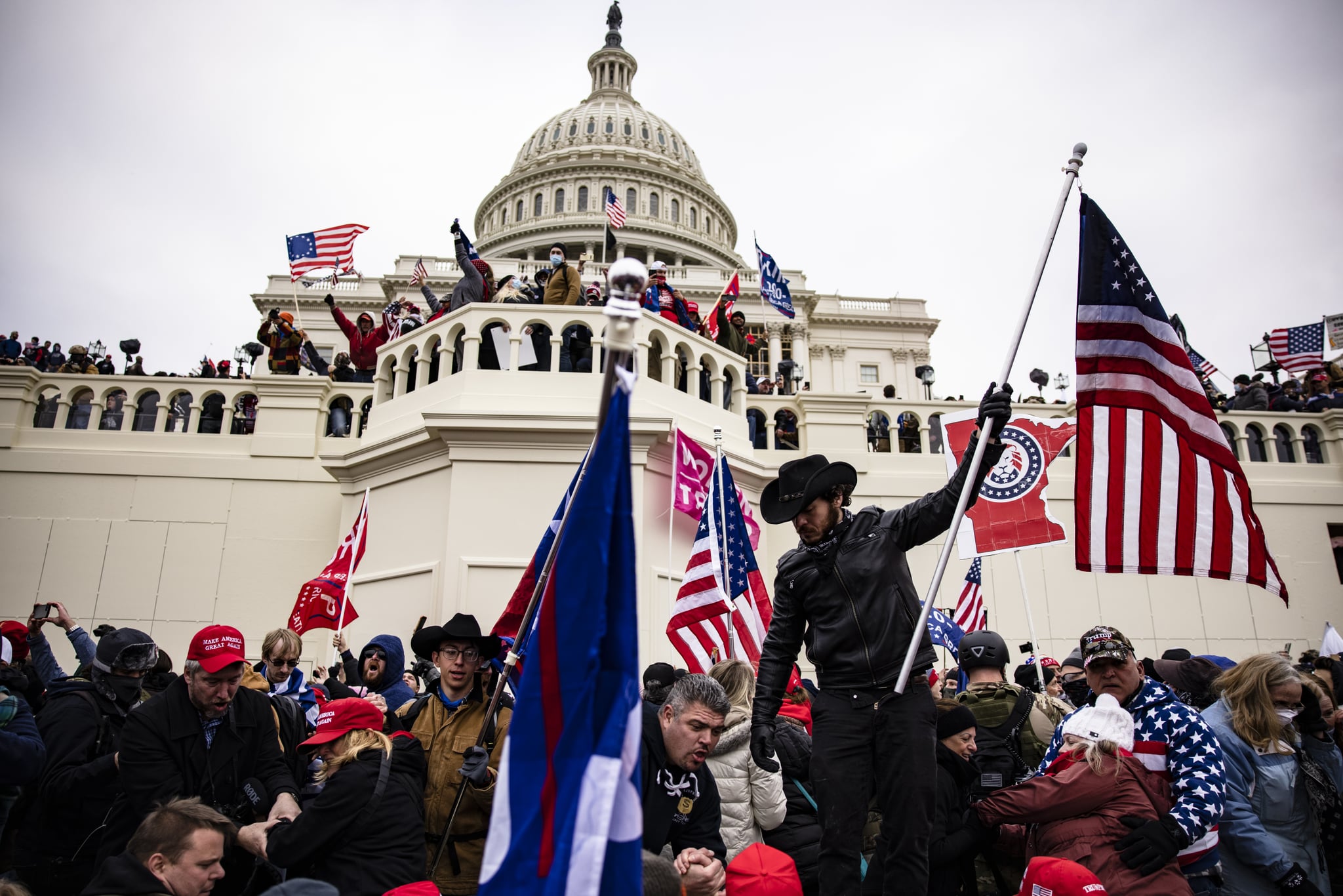 WASHINGTON, DC - JANUARY 06: Pro-Trump supporters storm the U.S. Capitol following a rally with President Donald Trump on January 6, 2021 in Washington, DC. Trump supporters gathered in the nation's capital today to protest the ratification of President-elect Joe Biden's Electoral College victory over President Trump in the 2020 election. (Photo by Samuel Corum/Getty Images)