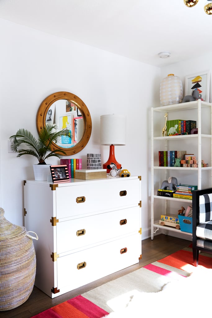 With so many fun pieces, the look stays calm with a neutral base—white walls, white dresser, white shelving. Coco and James use this rule elsewhere in the house, to let their art collection really stand out.