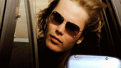 Riggins shouts at people from the driver's seat.
